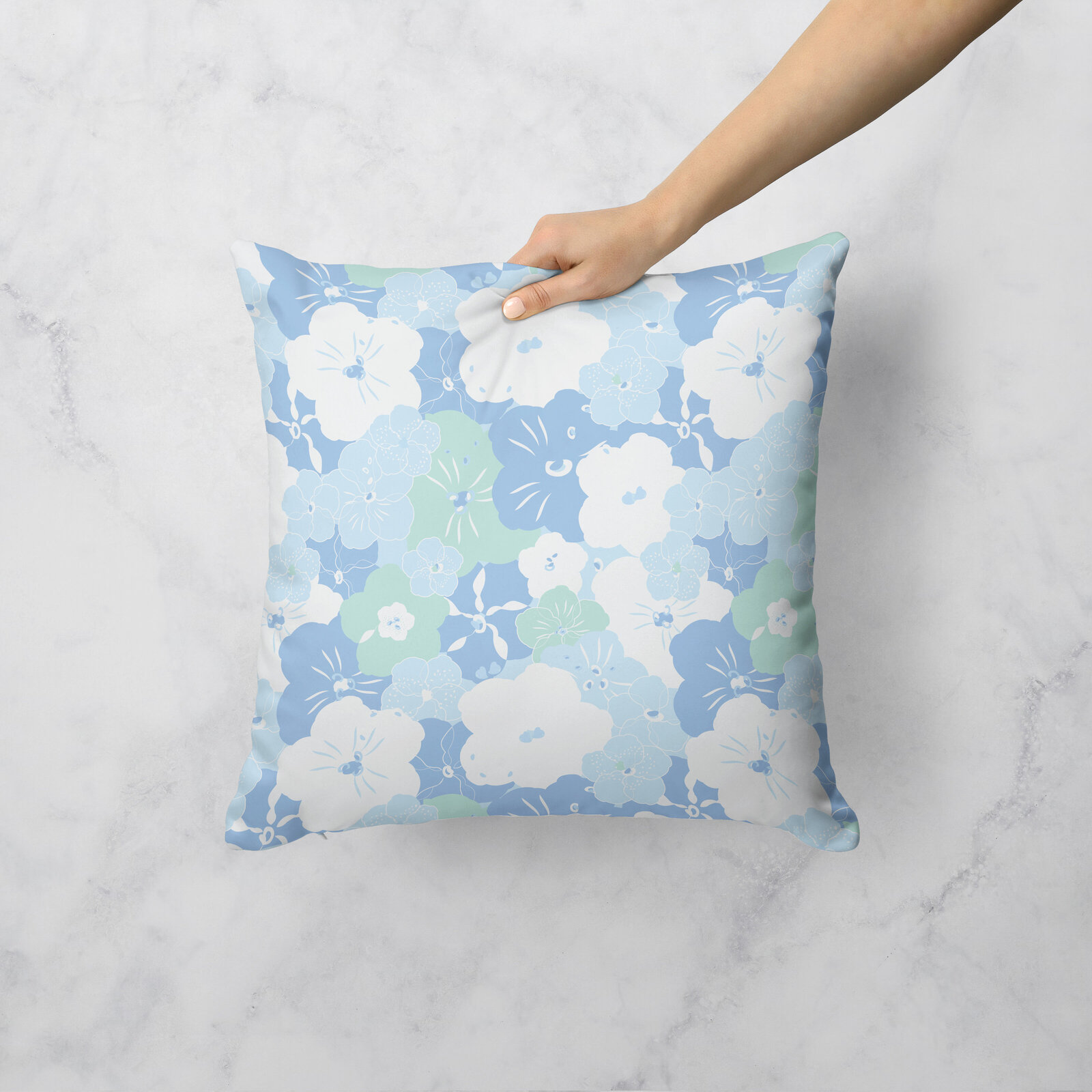 blue and white floral pillow