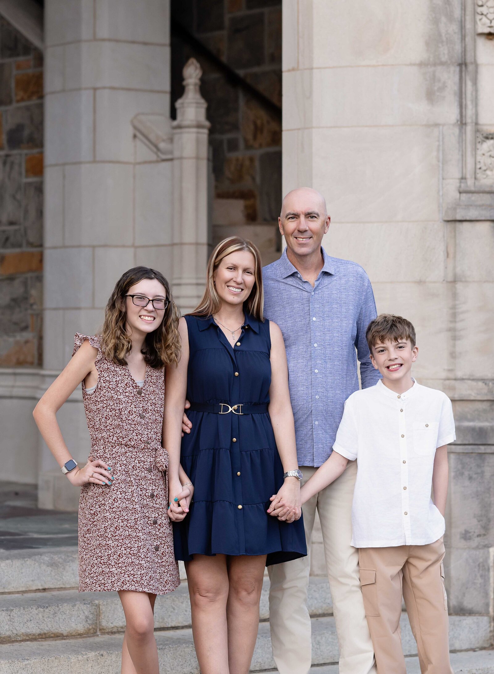 Family of 4 posing for a family photoshoot. Family Photography by Jenni Nikki Photography- Atlanta Family Photographer.
