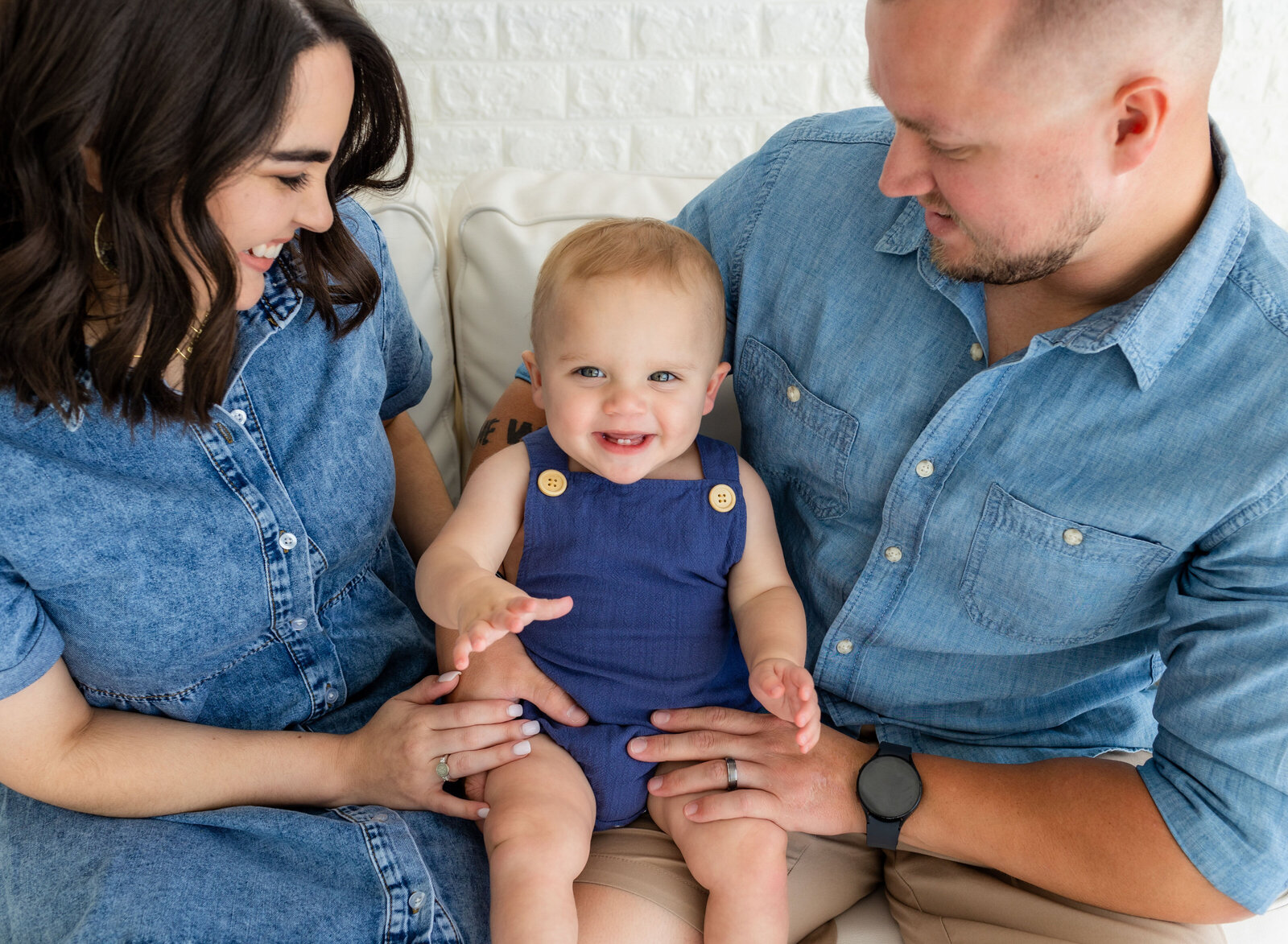 laughing baby with parents