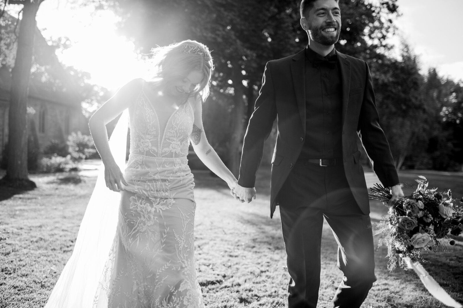 Emotive wedding moment—bride and groom walk hand in hand, a quiet luxury image of intentional connection.