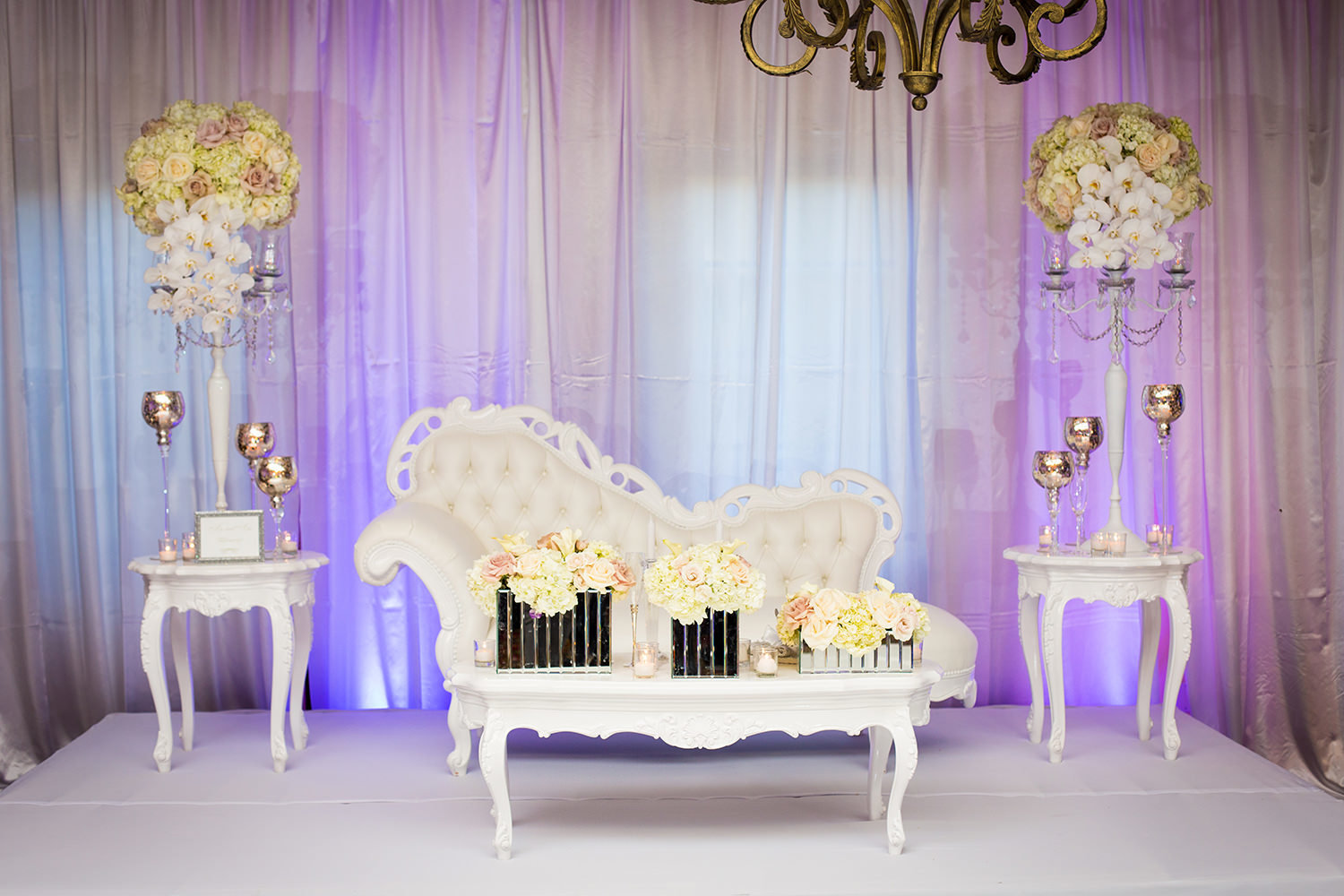 reception room at the crosby club white flowers