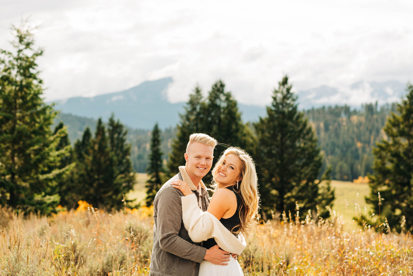 Immerse yourselves in the vibrant hues of autumn at Yellowstone National Park with our exclusive fall engagement photo sessions. Amidst the golden canopies and fiery landscapes, let our expert photographers capture the warmth of your love against nature's majestic backdrop. From the iconic geysers to the tranquil riverside vistas, every frame tells a story of romance and adventure. Book your unforgettable Yellowstone National Park fall engagement photo session today and preserve the magic of this special season forever