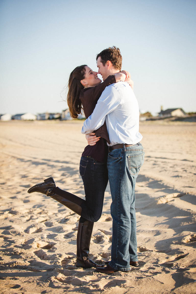 Engaged couple kiss, Lewes Beach, Delaware