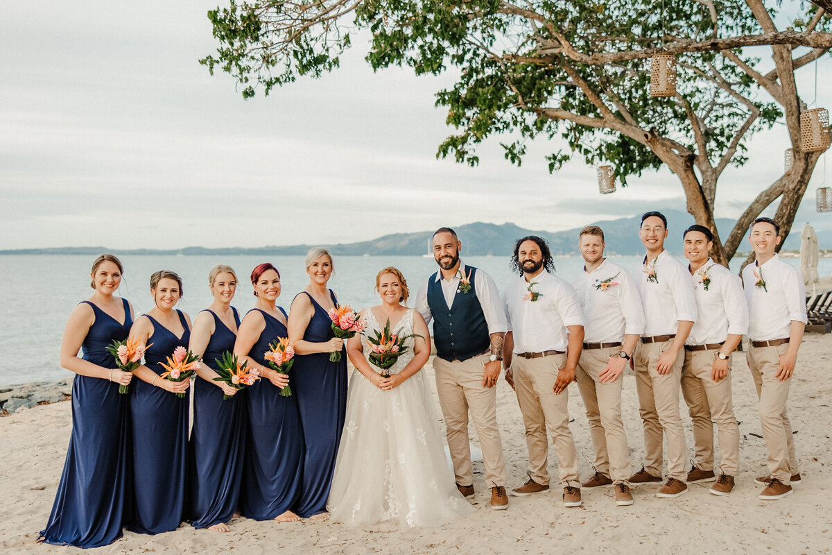 Bridal party on beach for island wedding