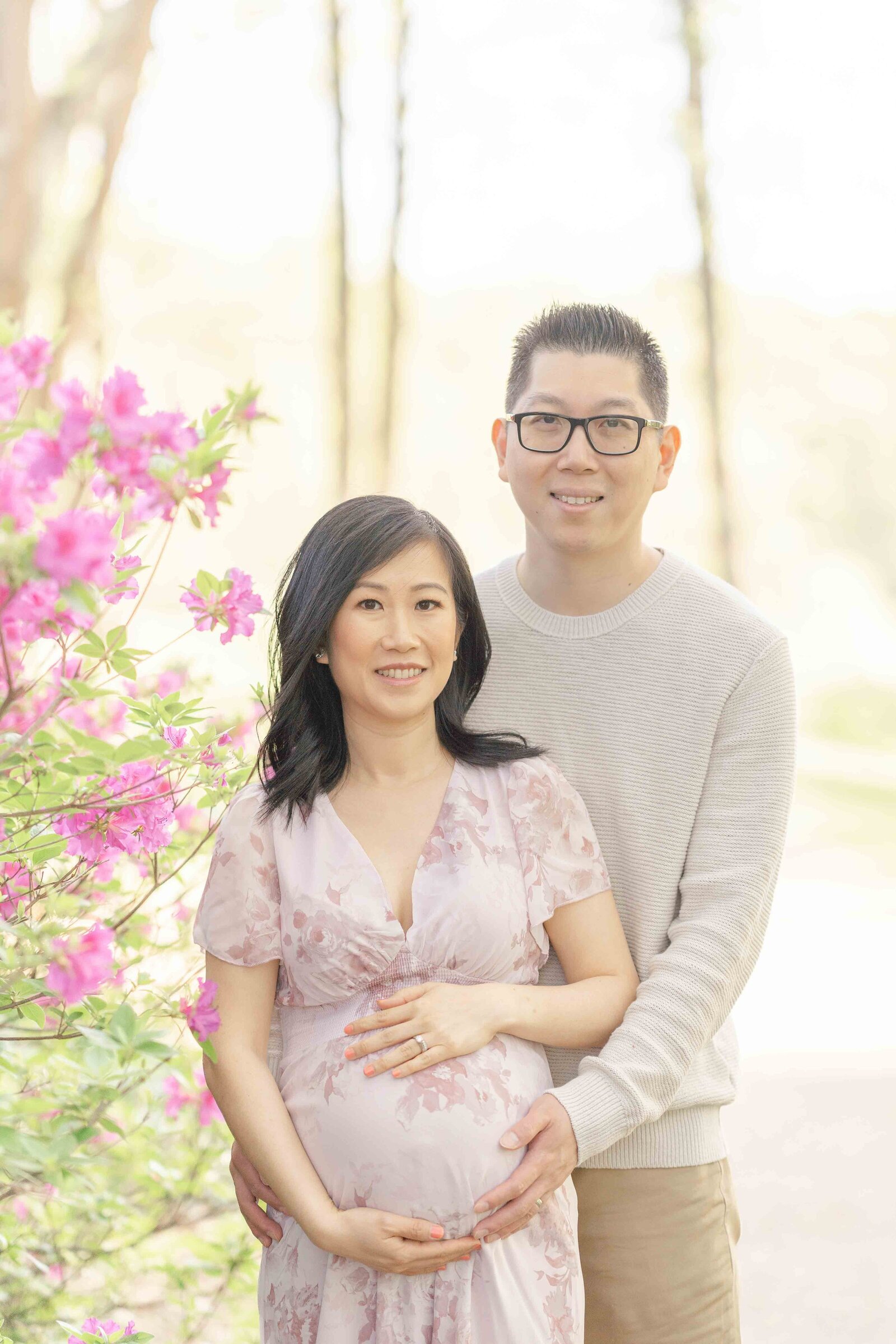 expecting couple smiling during maternity photography in Ashburn, Virginia