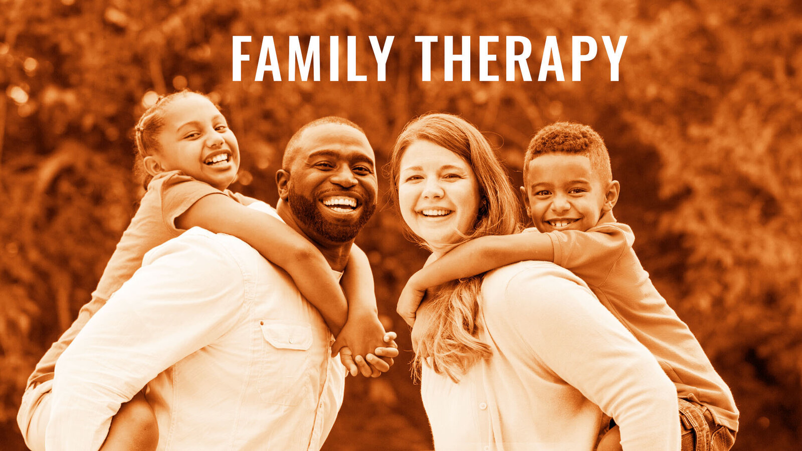 Biracial family smiling with words family therapy