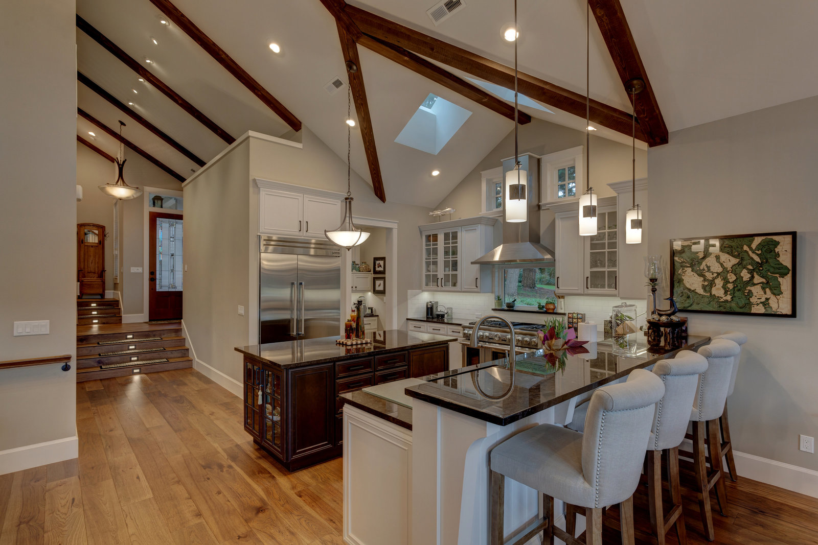 kitchen and dining area with exposed beam ceilings