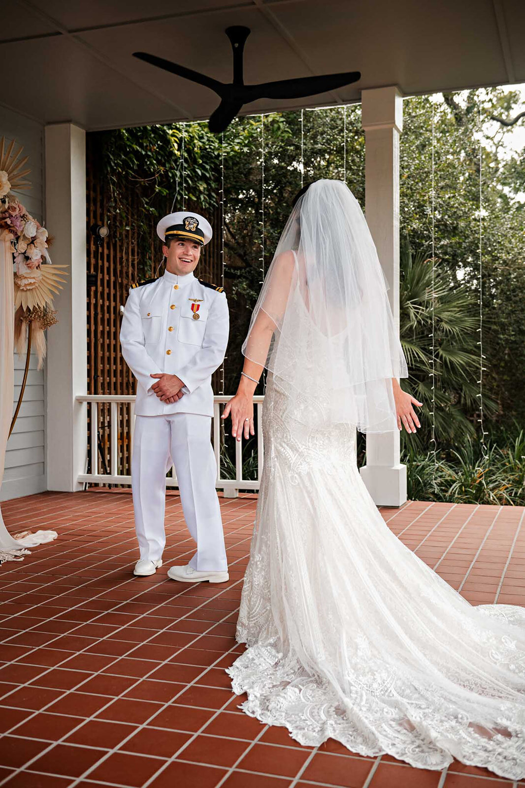 A tender moment between the bride and groom at an outdoor wedding altar, captured at a Texas Hill Country wedding by CMH Studios.