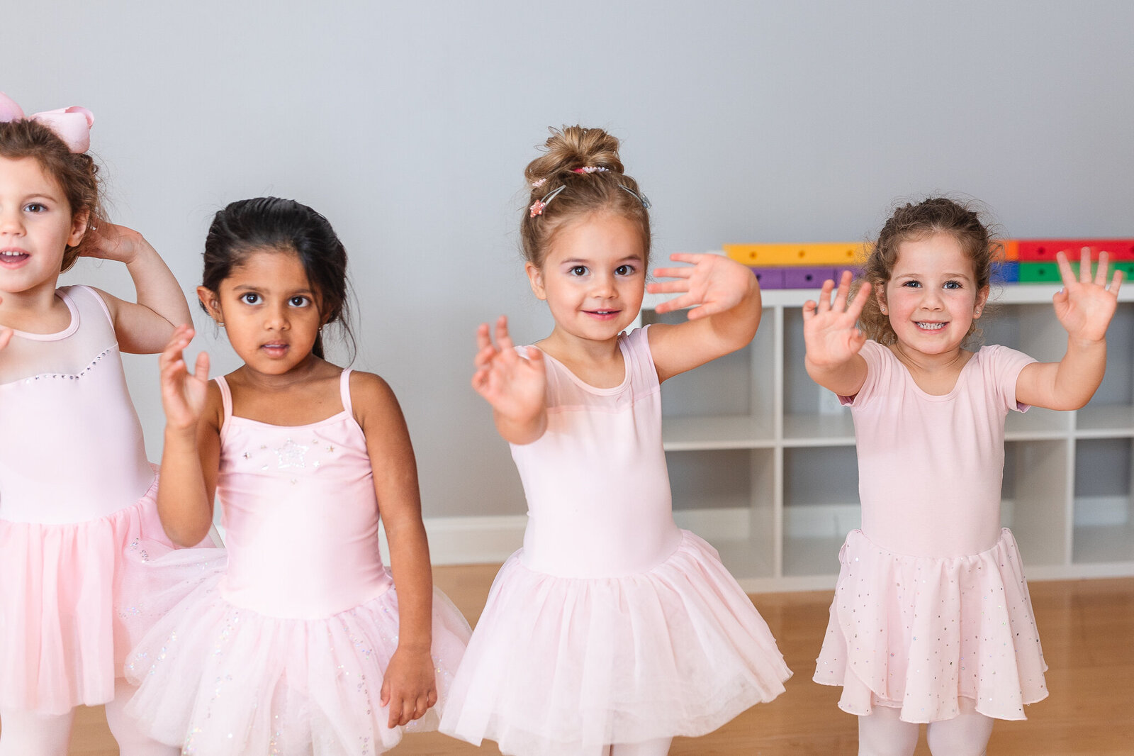 dancers show off their stamps to the camera, smiling
