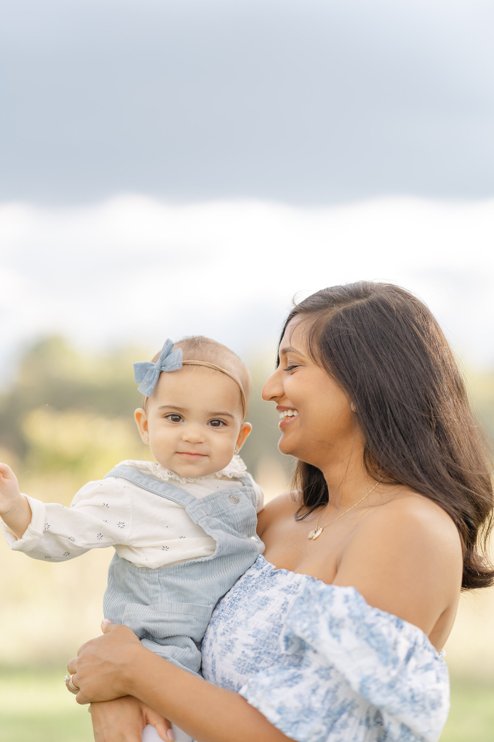 mom looking at baby smiling during family picture in Sterling,VA