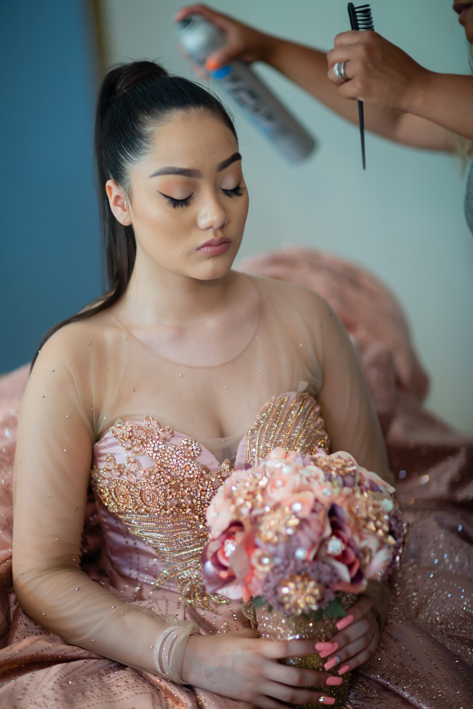 A candid moment of Rosalyn Kinsey getting ready for her quinceañera at home in Cleveland, Ohio. Capturing the excitement of this special day with TheWiz Photography.