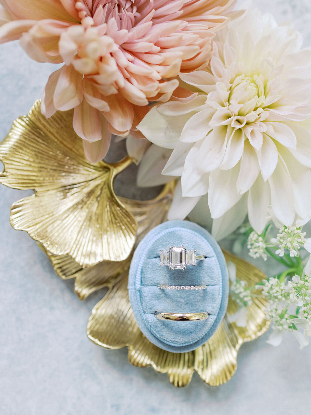 Pink and white flowers with blue box for engagement and wedding rings