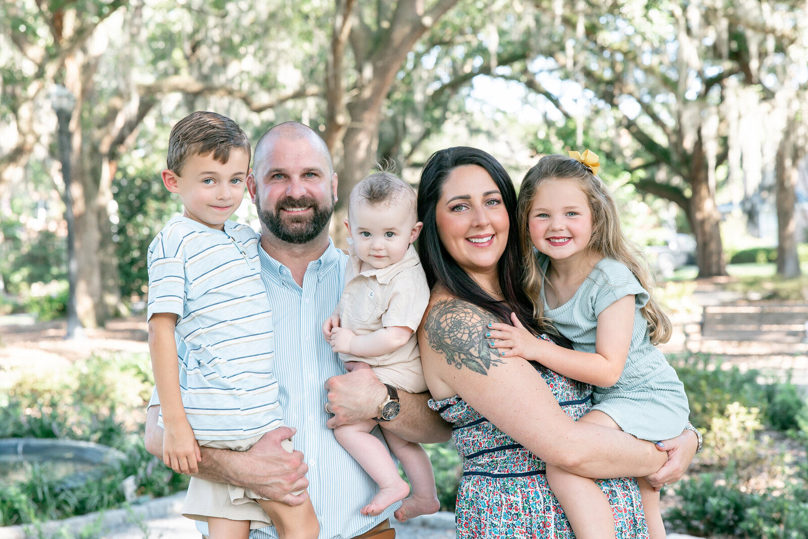 Family walking in park taken by Savannah family photographer Tiffany Bradley