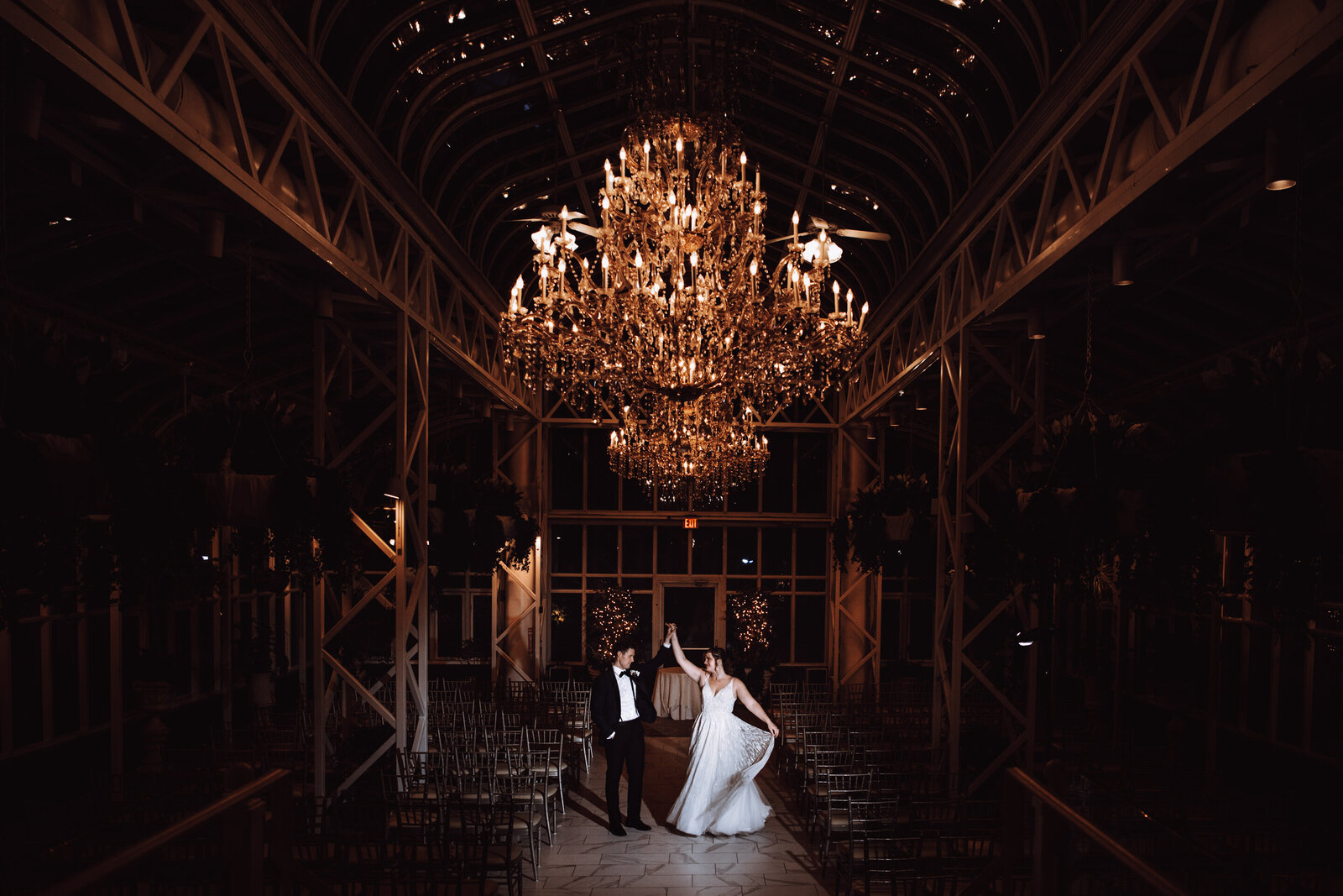 A sample image from Philadelphia wedding photographer Daring Romantics. A couple dances together at a beautiful wedding venue.