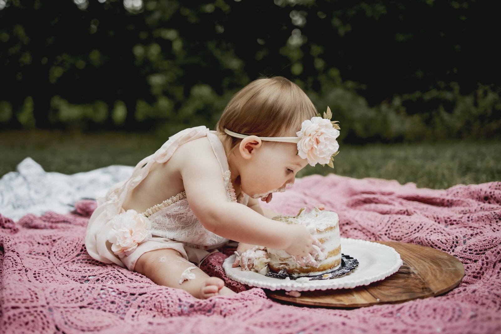 one year old eats her cake