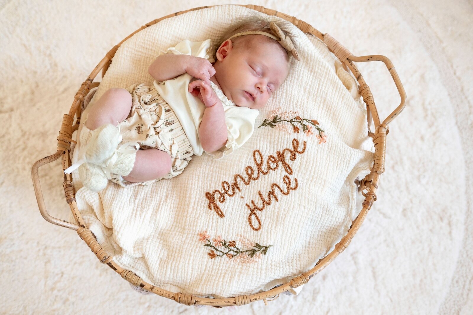 baby girl sleeping in basket