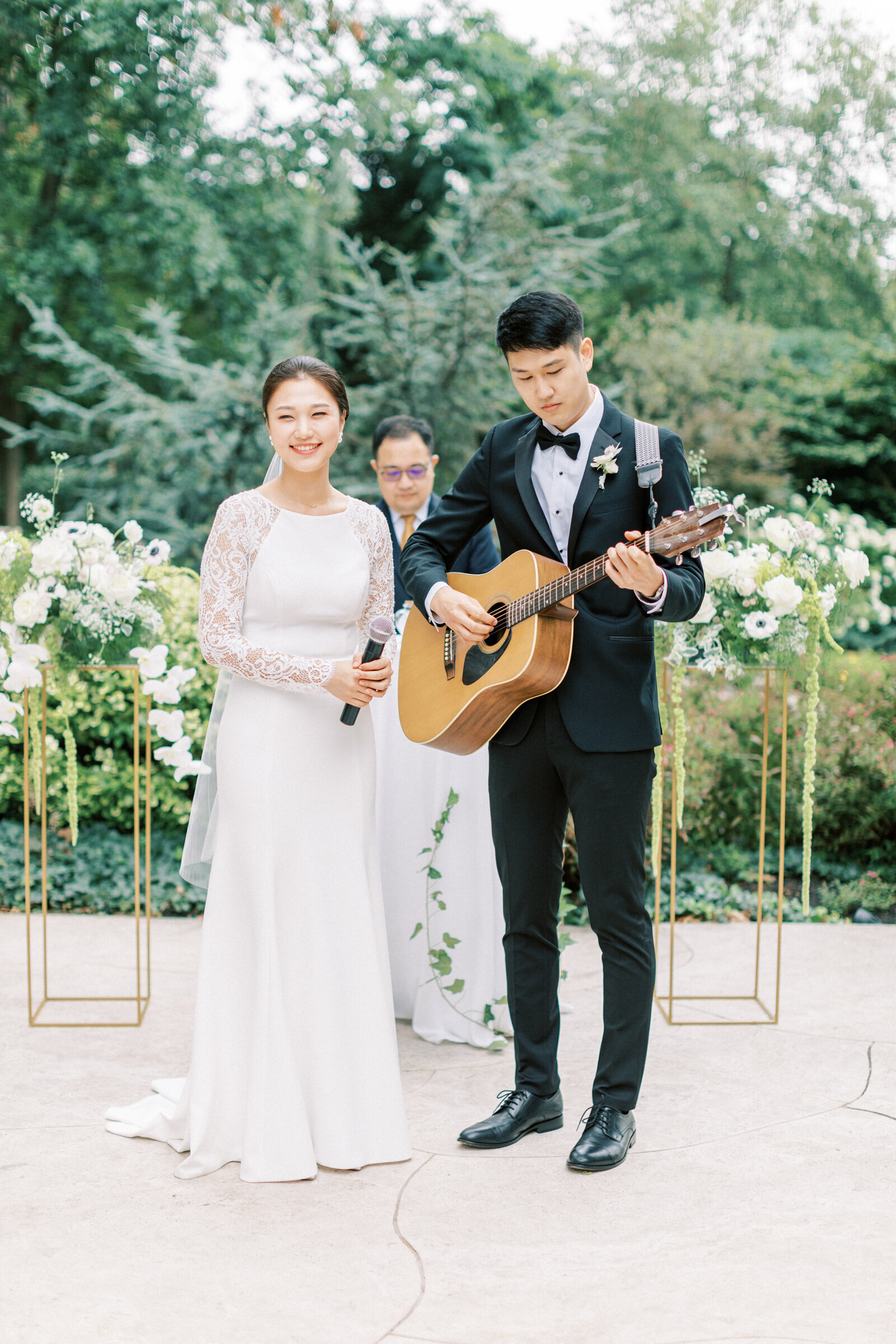 Couple sing at their wedding ceremony
