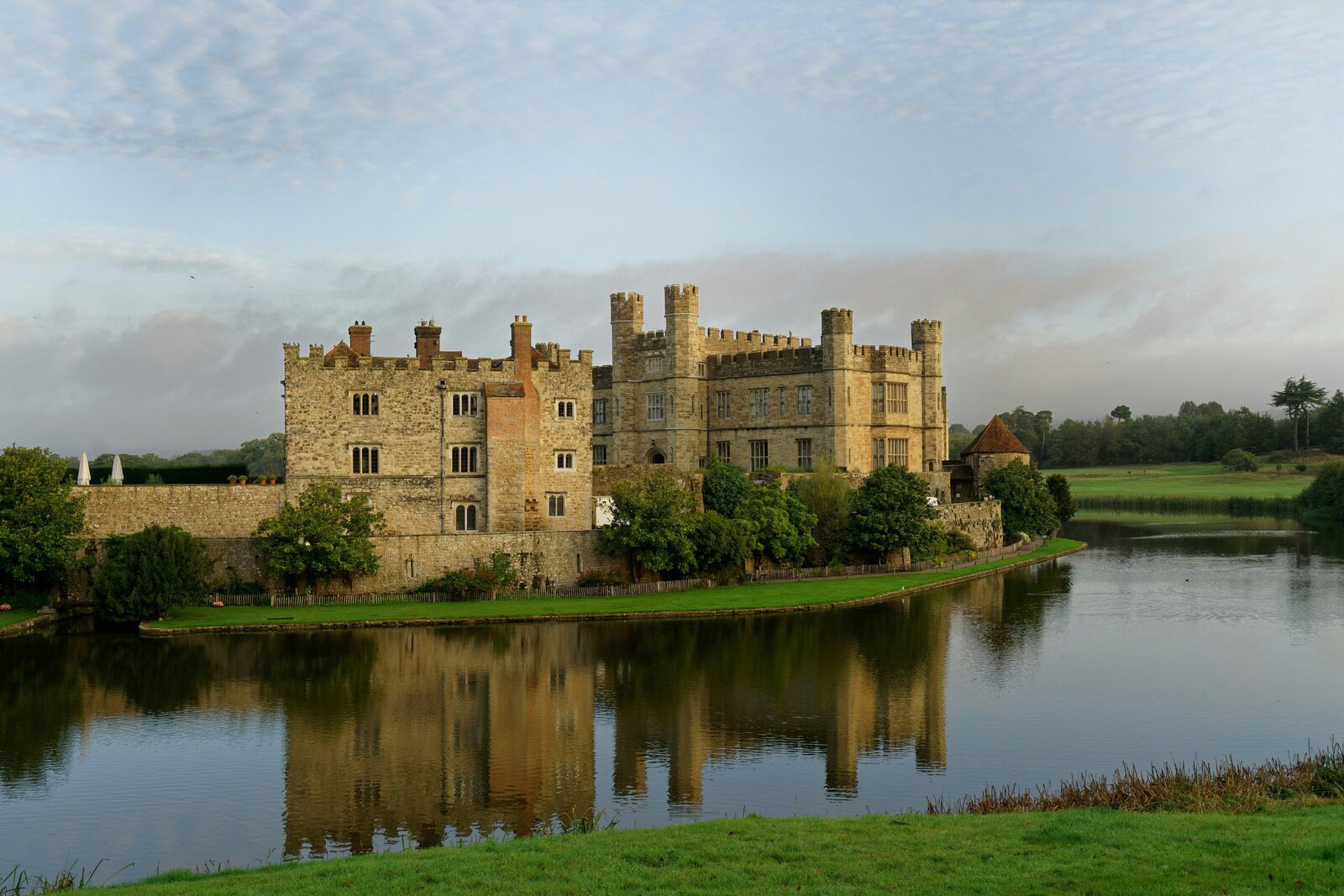 Leeds Castle in Kent moated island fortress at dusk. 