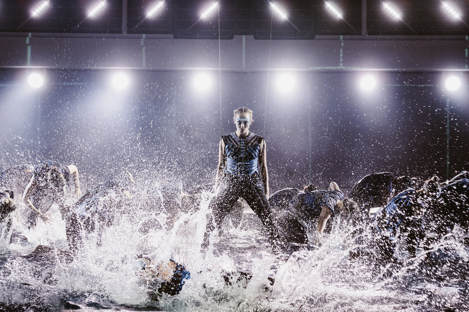 Dancers in watershow with aerialist