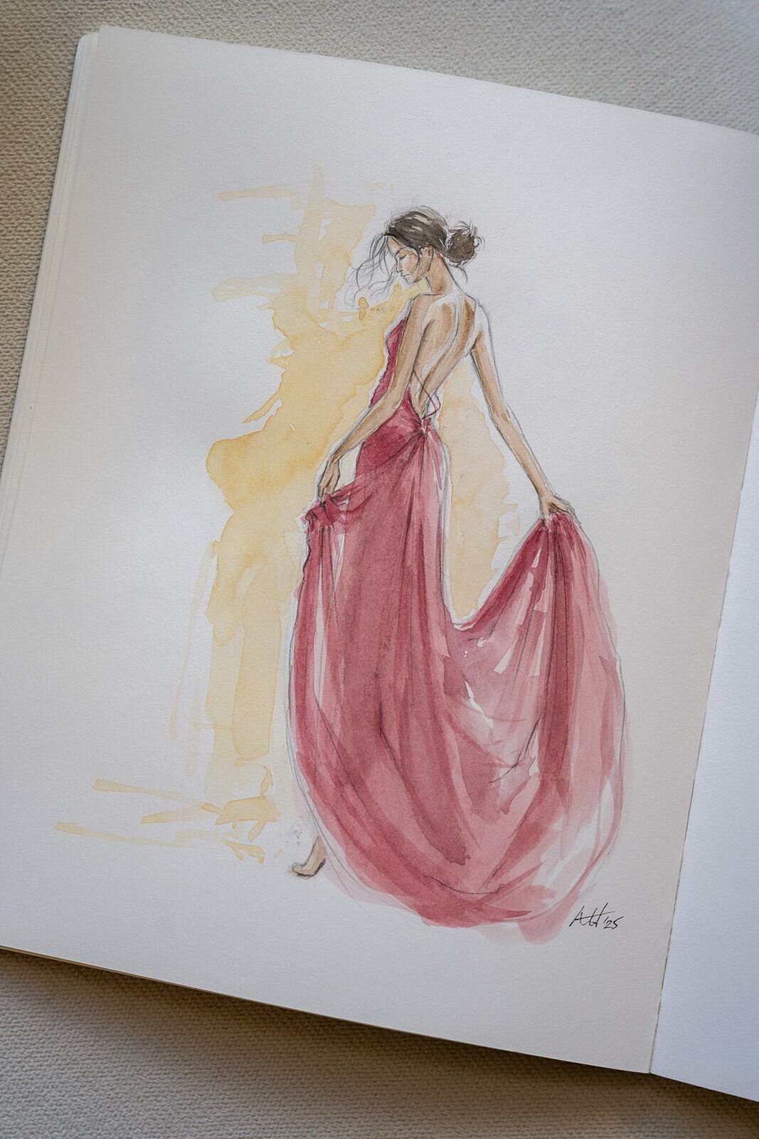 Watercolor fashion illustration of a girl in a red gown.