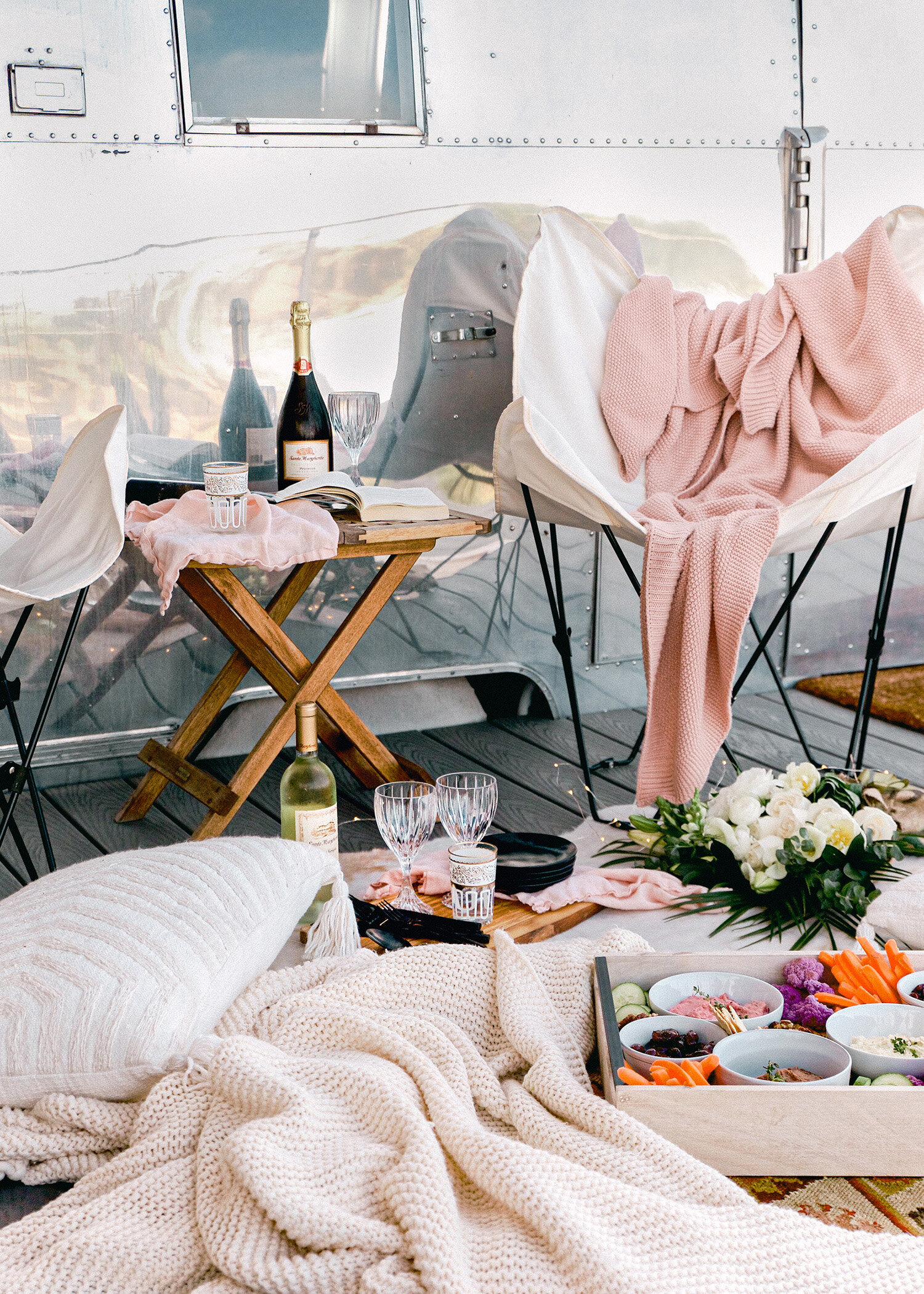 Luxe Airstream Camping Setup with food for blogger Lauren Saylor A Fabulous Fete Boho Summer Picnic Outside Product Photography Wine
