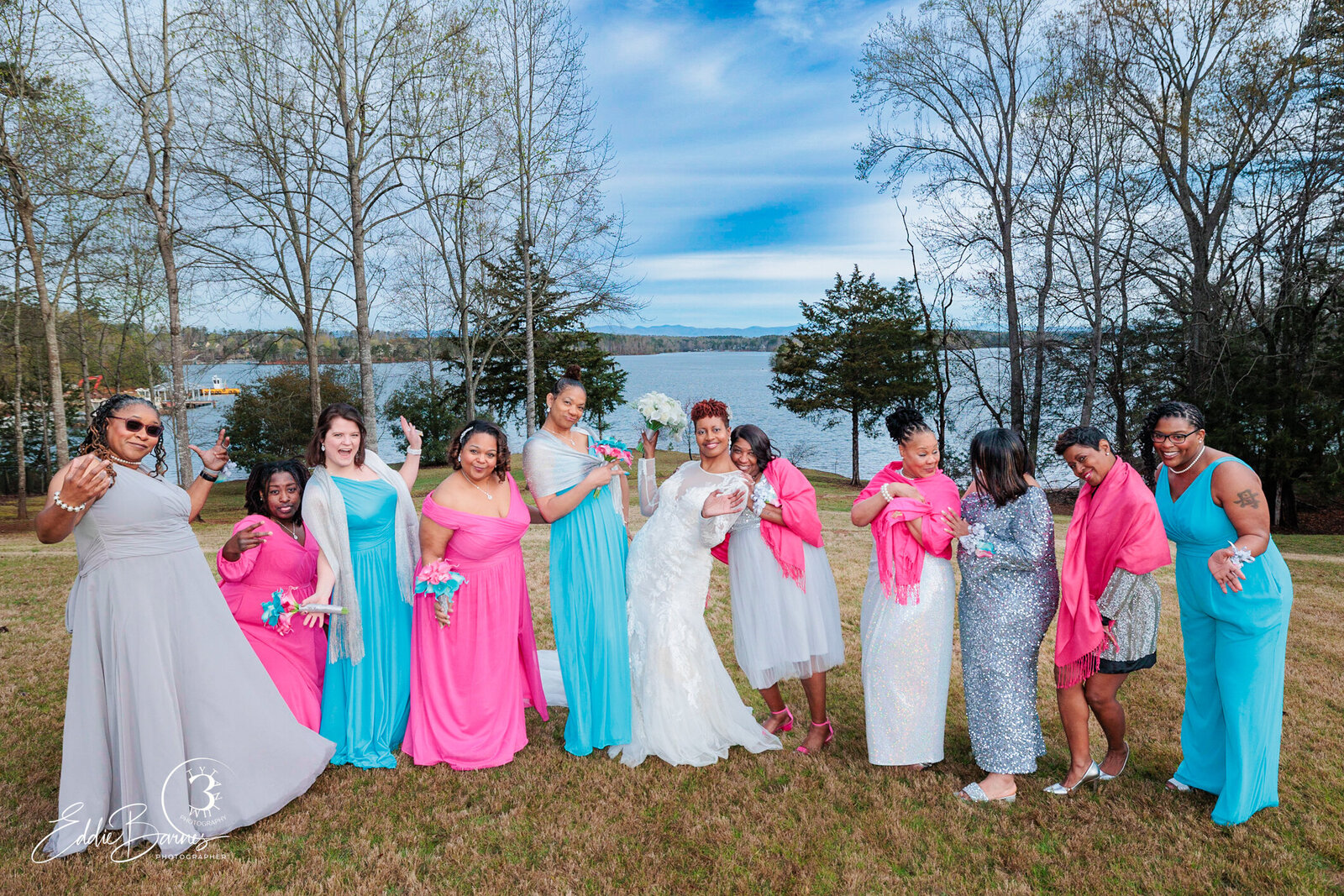 wedding party posing outdoors nearlake