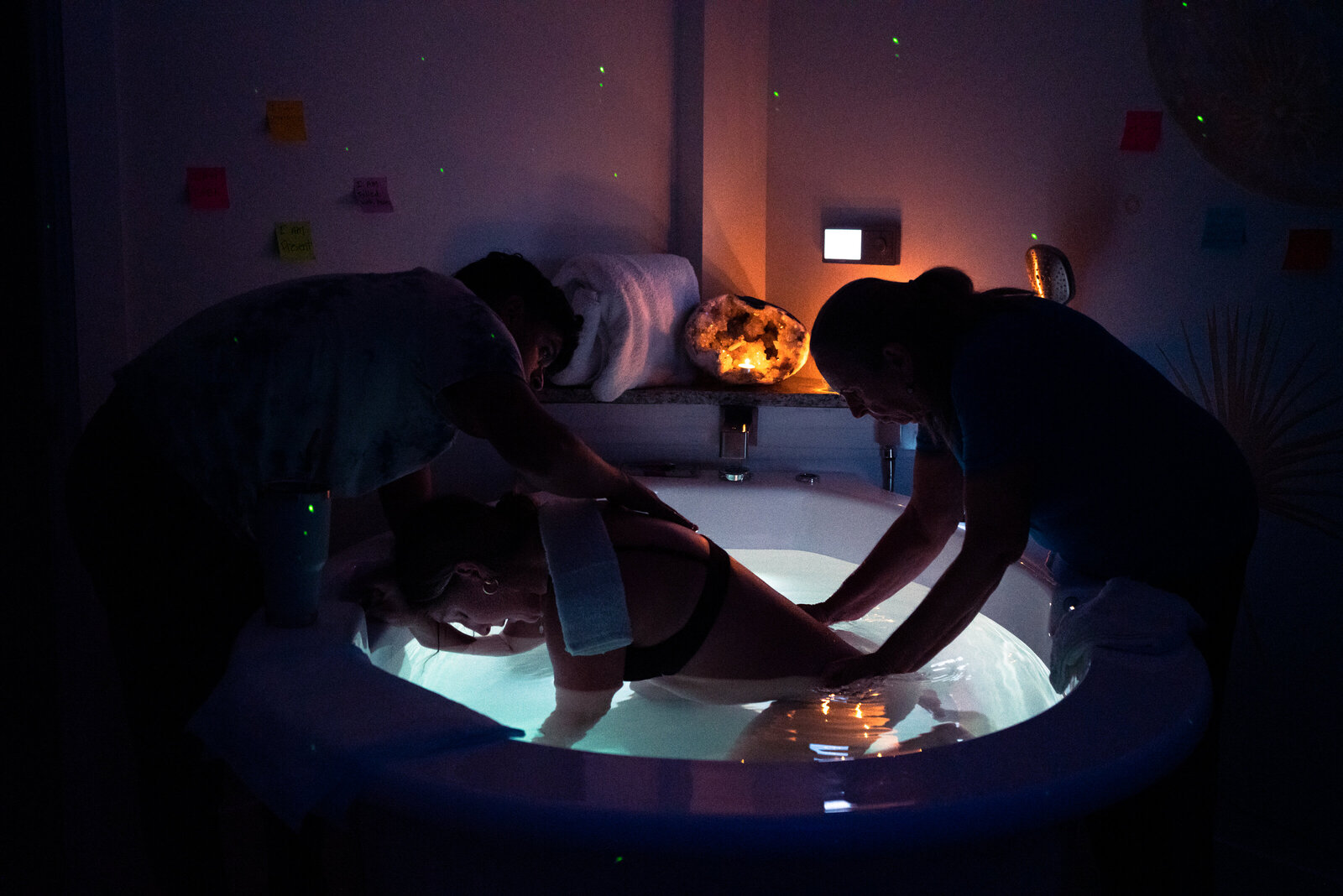 Mother laboring in birth tub at local birthing center in Palm Beach County, FL