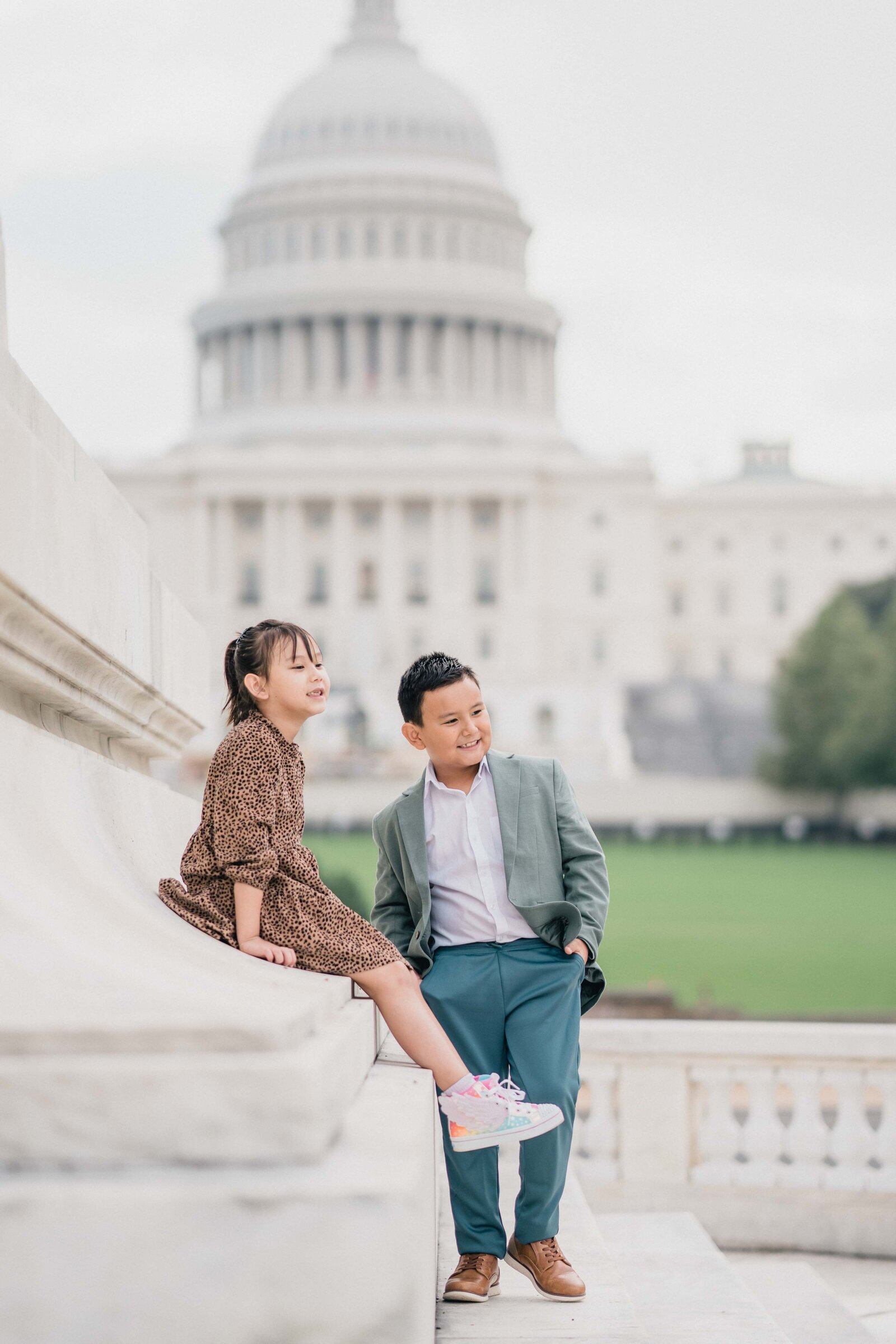 brother and sister in front of capital building