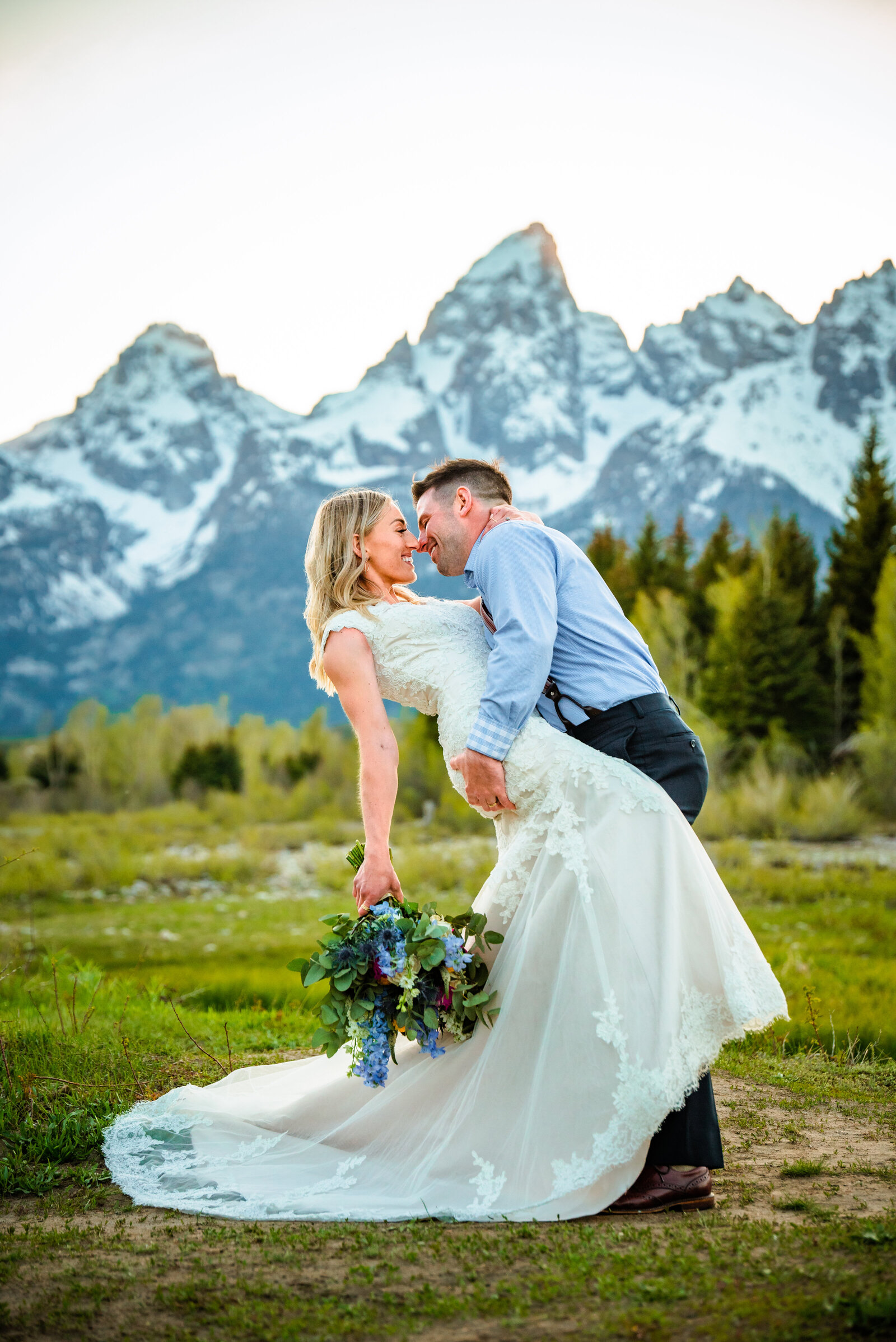 Jackson Hole photographers capture couple kissing in Grand Tetons after Grand Teton wedding