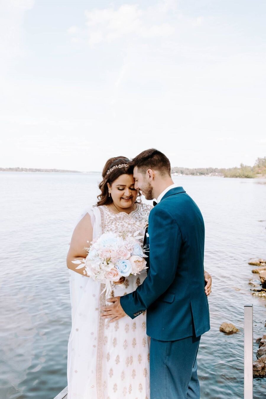 Ottawa couple shares a tender look, bride’s makeup by Red Carpet Glamour completing their wedding day style.