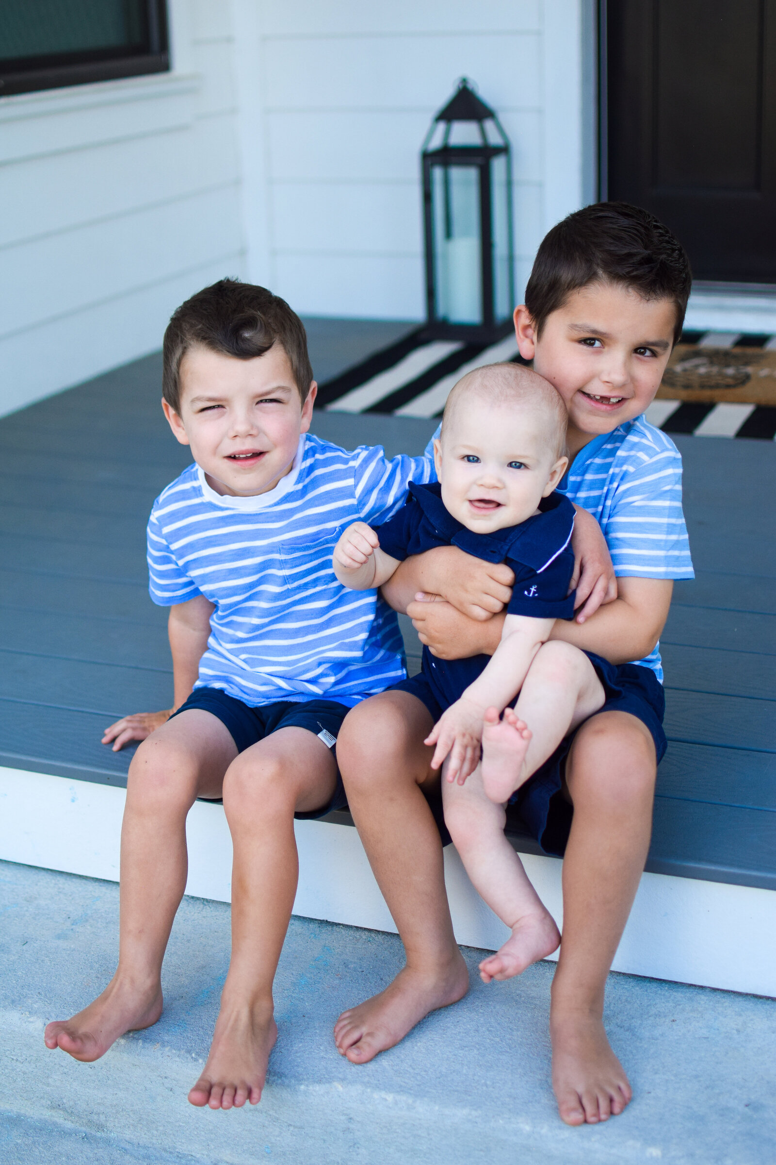 little boys sitting on steps southern front porch project Oakland Park