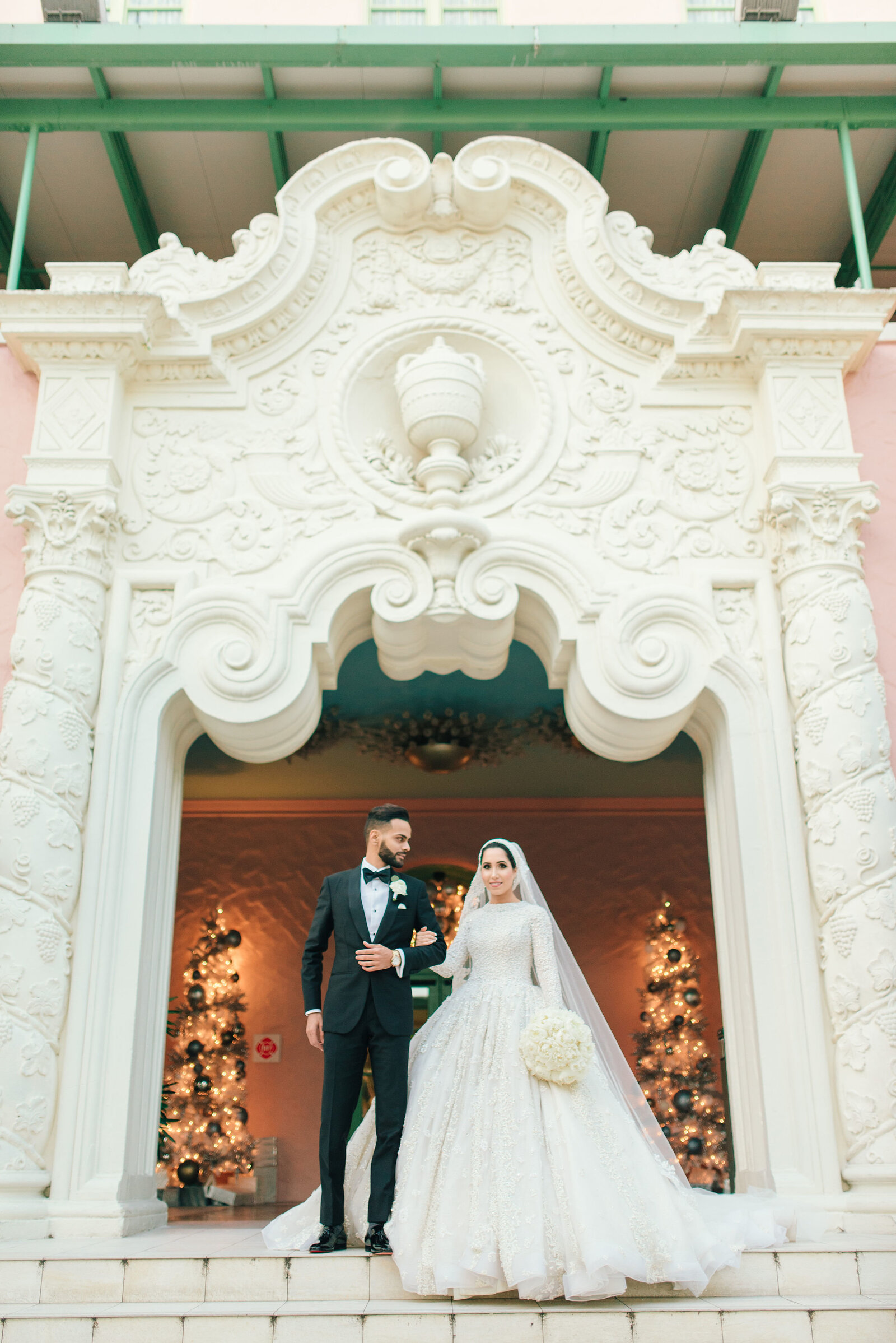 Bride and groom in front of Vinoy Renaissance entrance