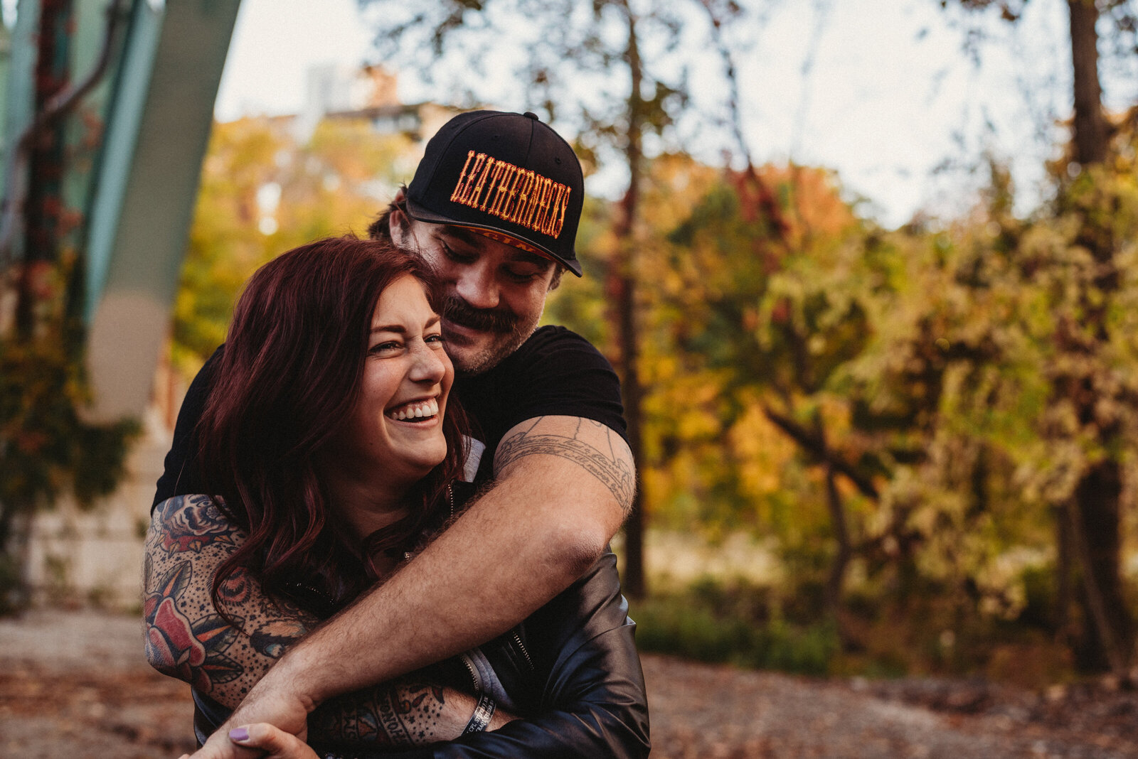 Couple laughing in fall engagement session in Cleveland