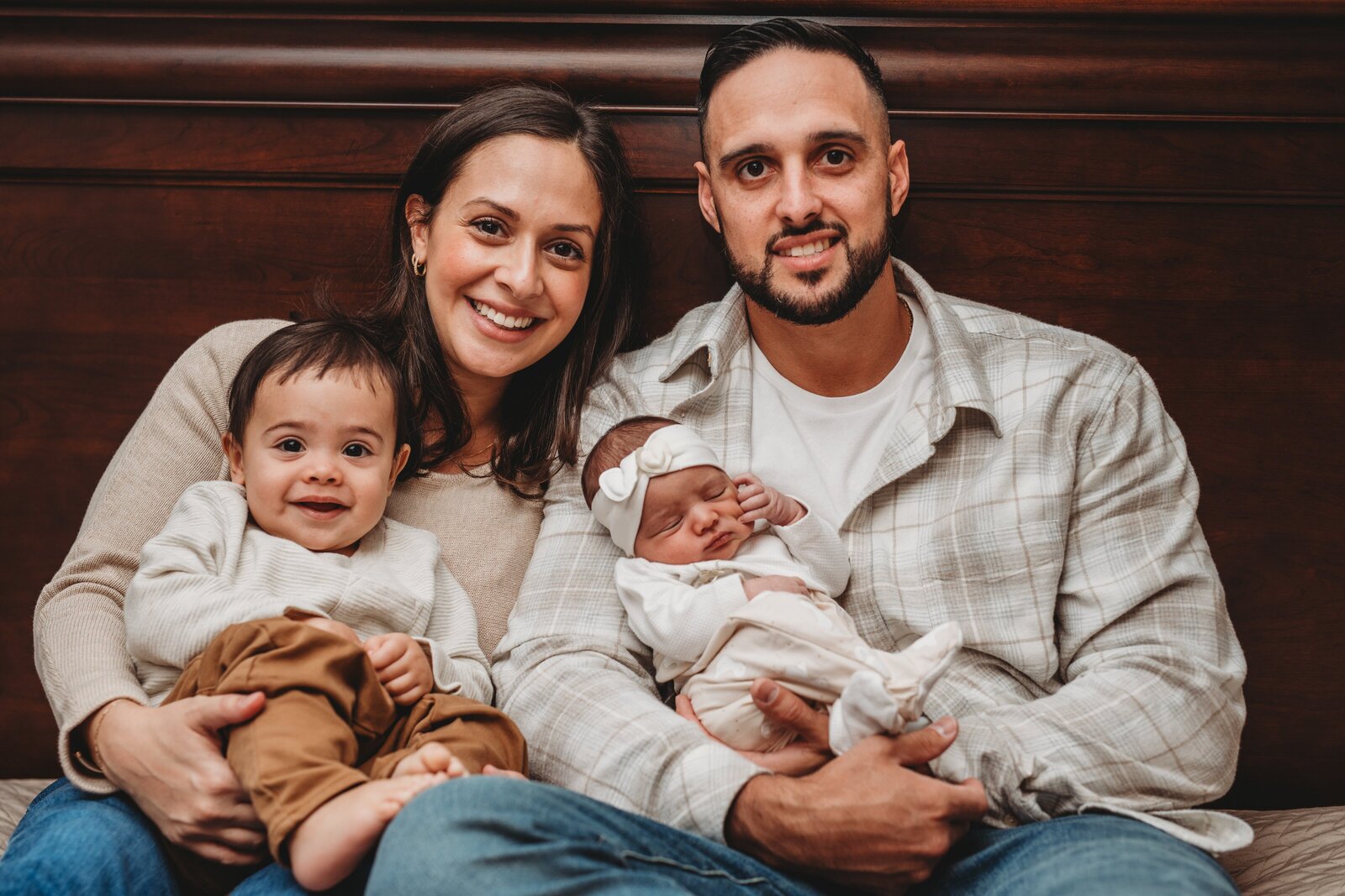 Capture the joy of welcoming a new baby into your family with a cozy, in-home newborn photography session. This Connecticut family portrait radiates love, warmth, and connection, preserving the earliest days of your growing family in a natural and timeless way. Book your lifestyle newborn session today to document these cherished moments.