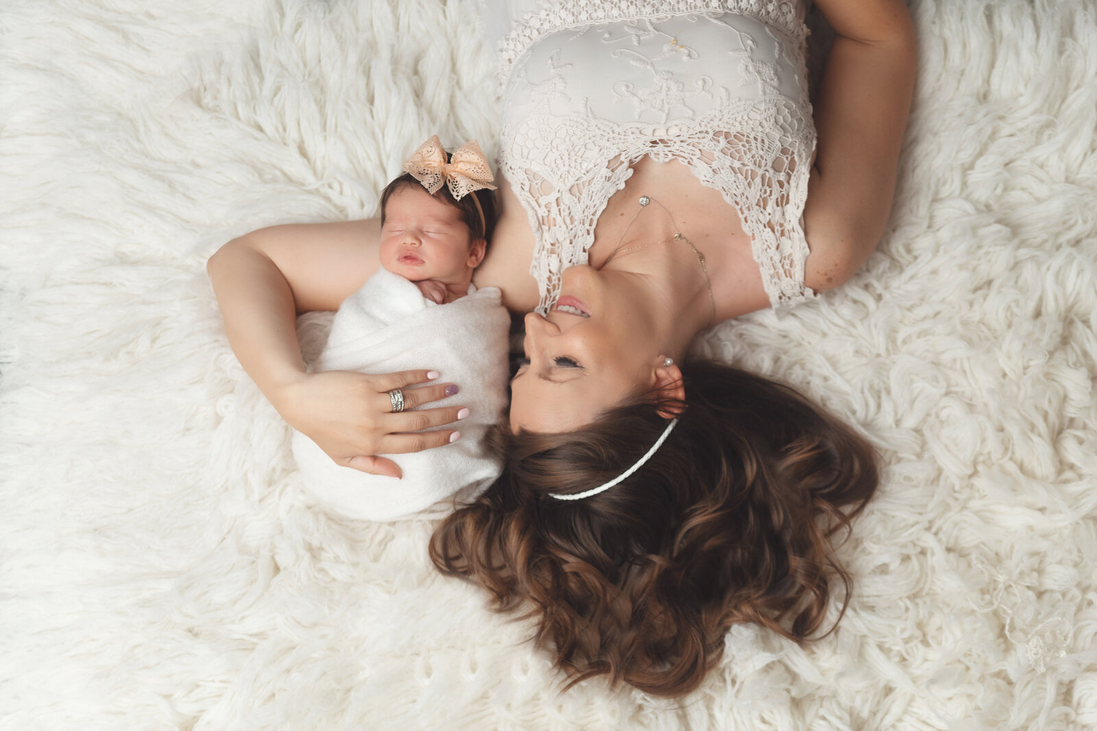 beautiful mom and baby overhead shot on white