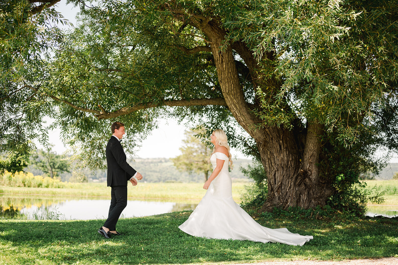 bride-groom-standing-tree