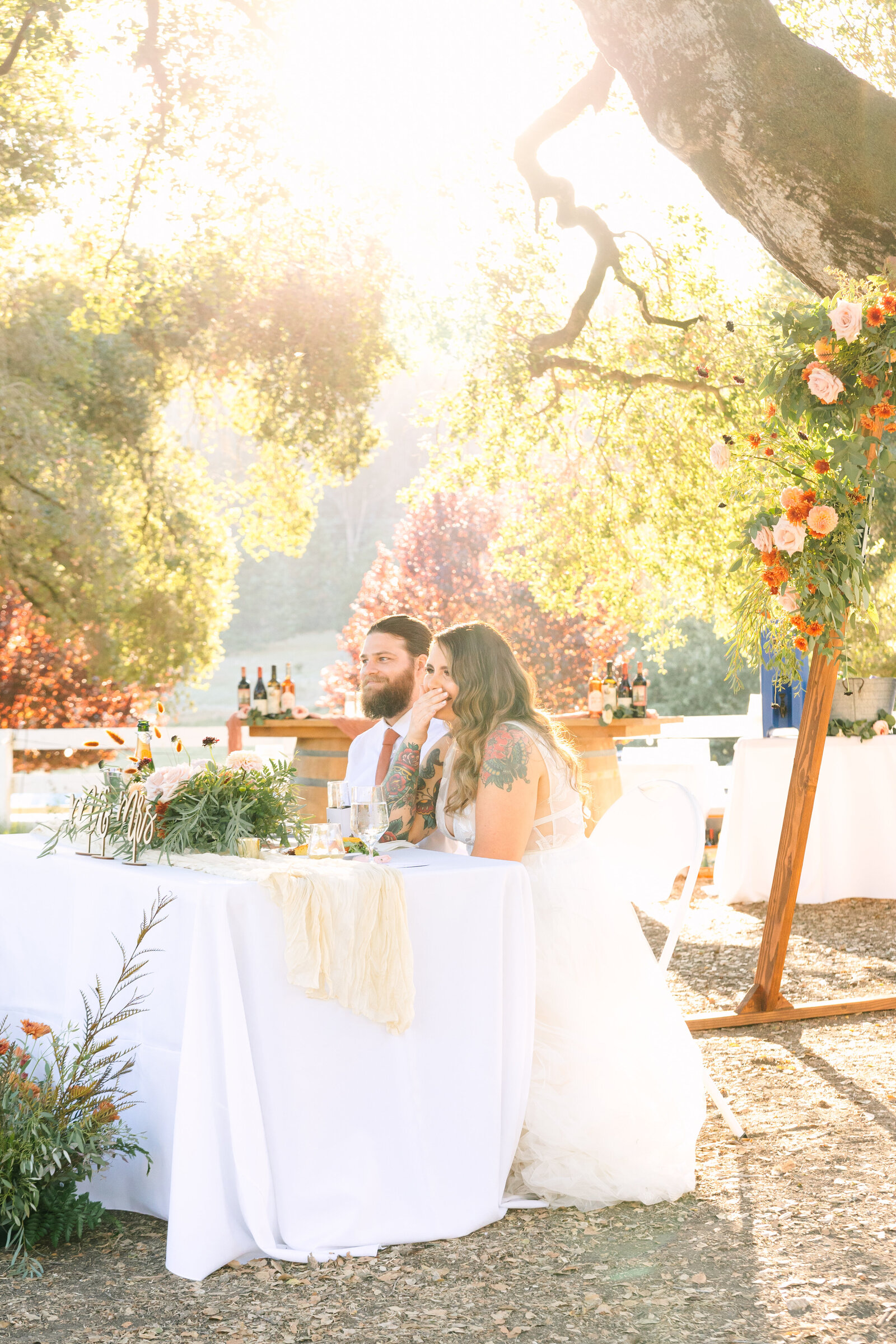 Tattoo bride and groom at their colorful wedding reception in Santa Cruz, California.