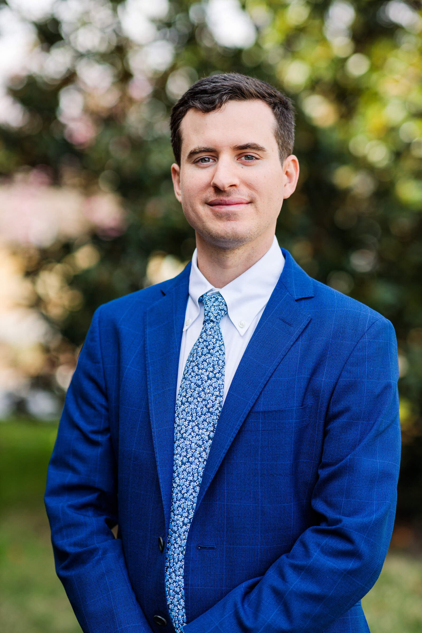 Man smiling in suit for professional headshot