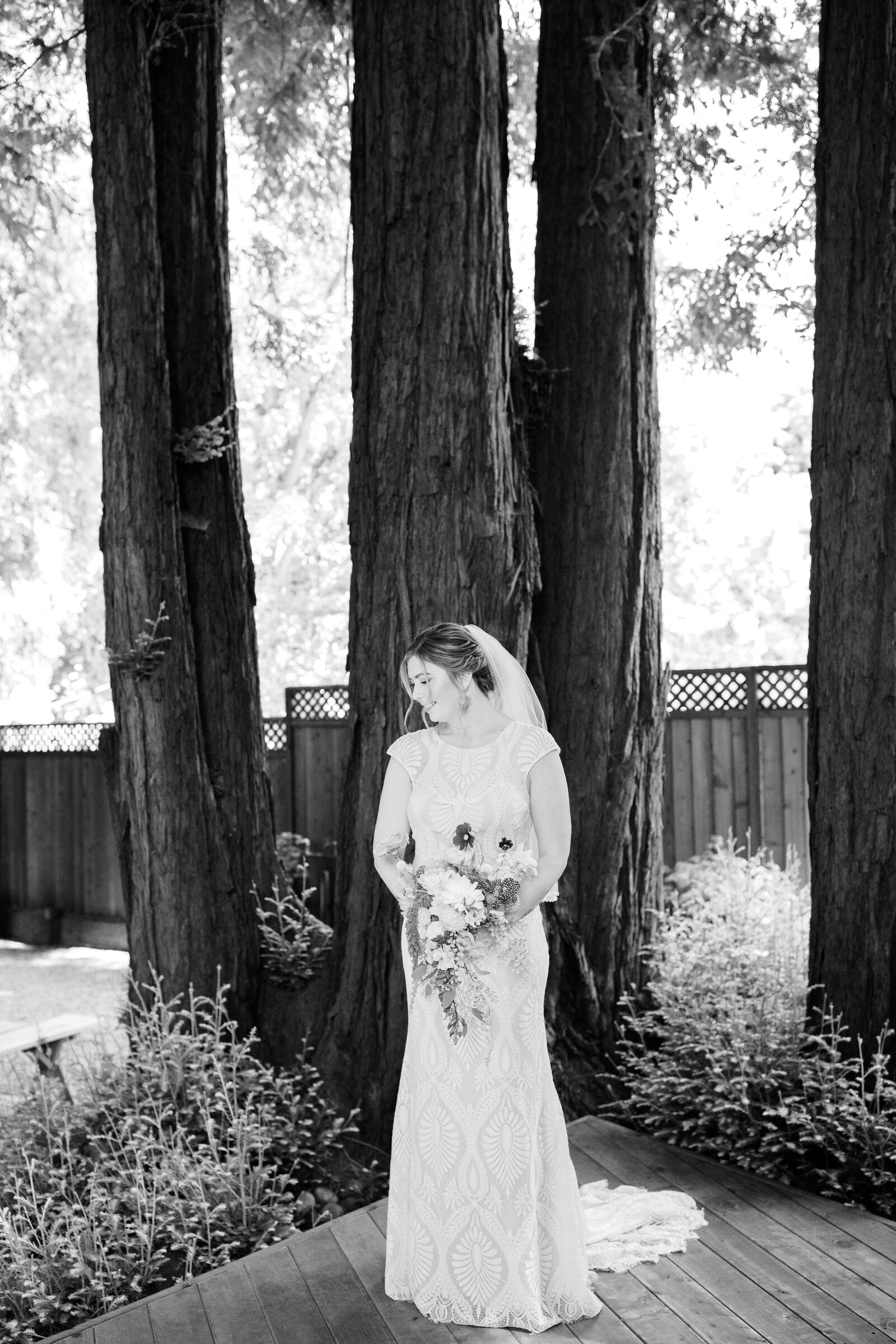 Bride on her colorful wedding day in Santa Cruz, California in the redwood trees.