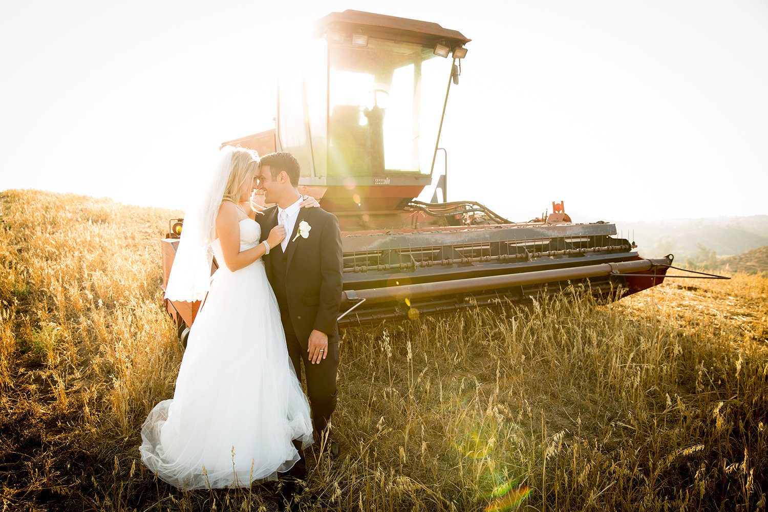 vintage tractor with bride and groom