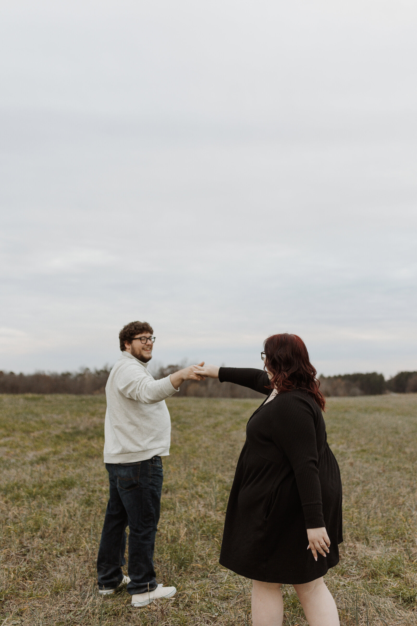 Engagement session in a field at August Busch WIldlife in St. Charles, MO