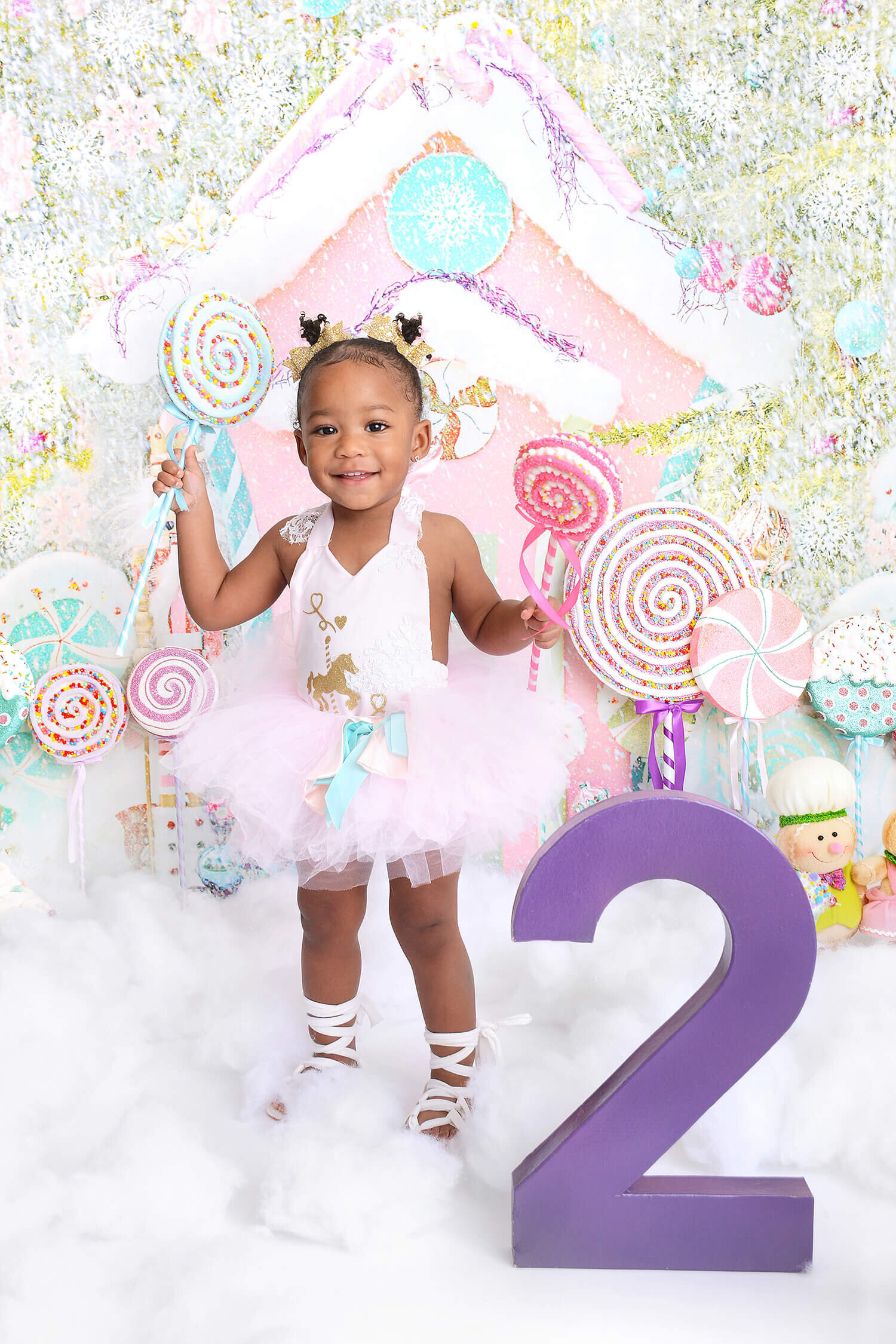 toddler girl smiles at her 2nd birthday photoshoot