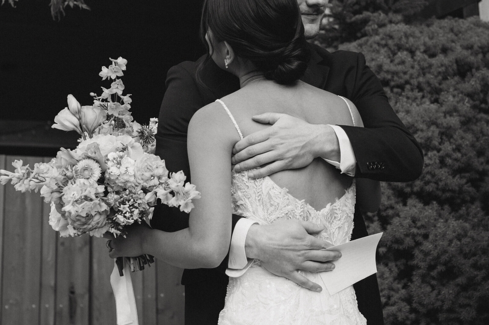 intimate embrace by Cranbrook bride and groom during their first look