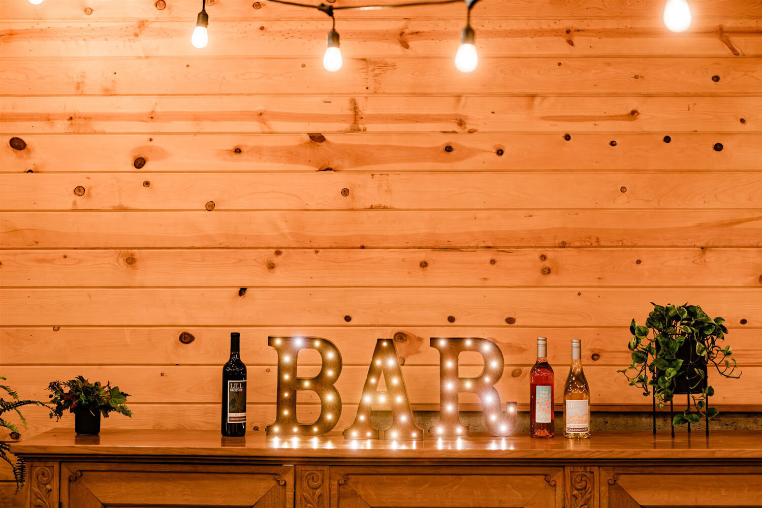 Rustic bar with marquee lights