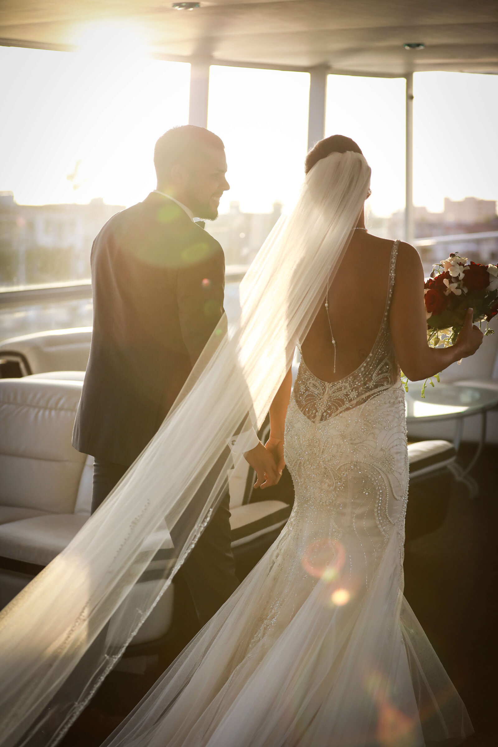 Newport Beach Wedding Photographer couple walking on boat on their wedding day