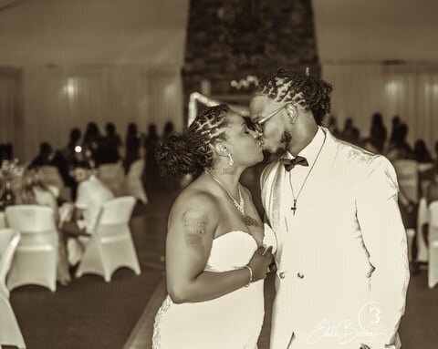 black and white image of couple kissing