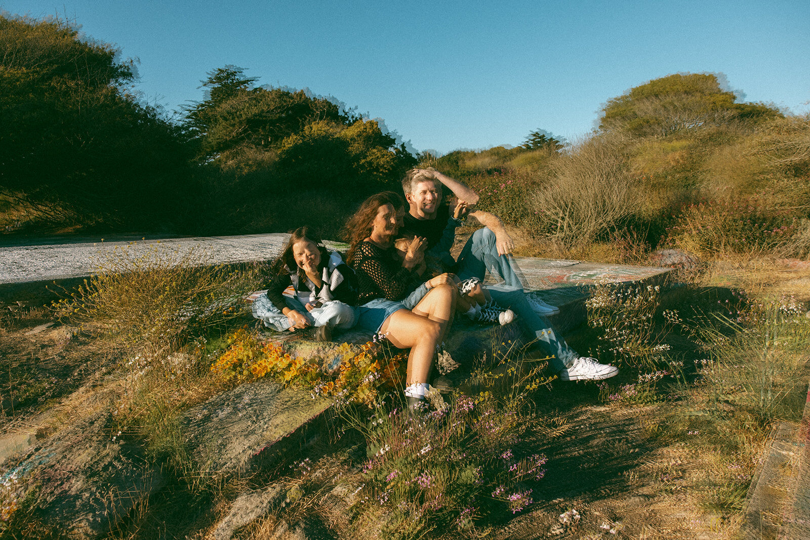 multiple exposure of family in golden hour light