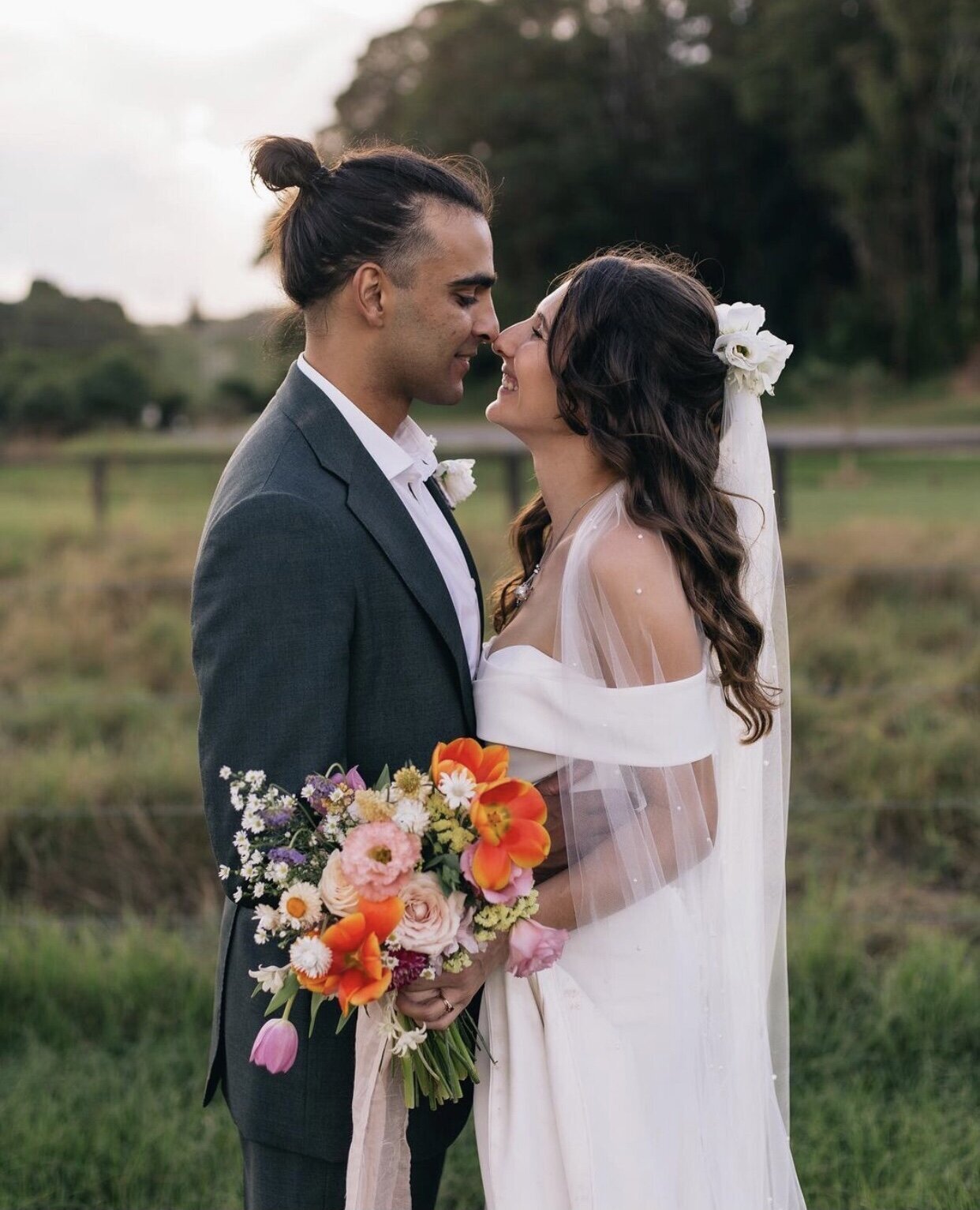 Bella Rae Bride Harriet looking beautiful natural  glam makeup and textured upstyle with husband aat Husk Distillery captured by Figtree Pictures