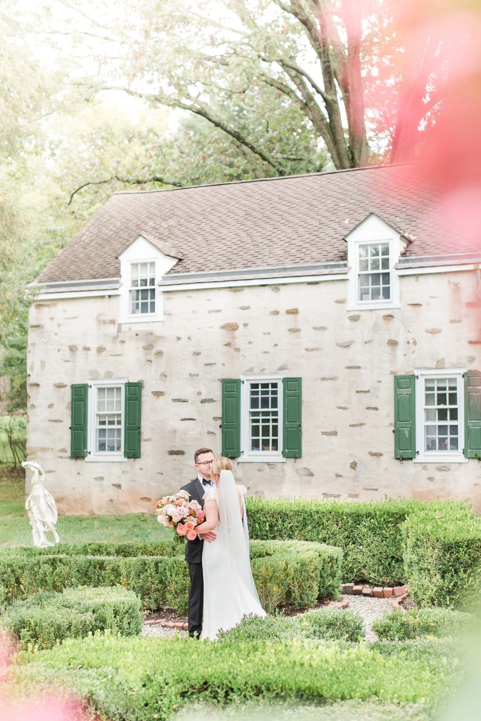 couple on wedding day looking into each other's eyes on a histpric venue