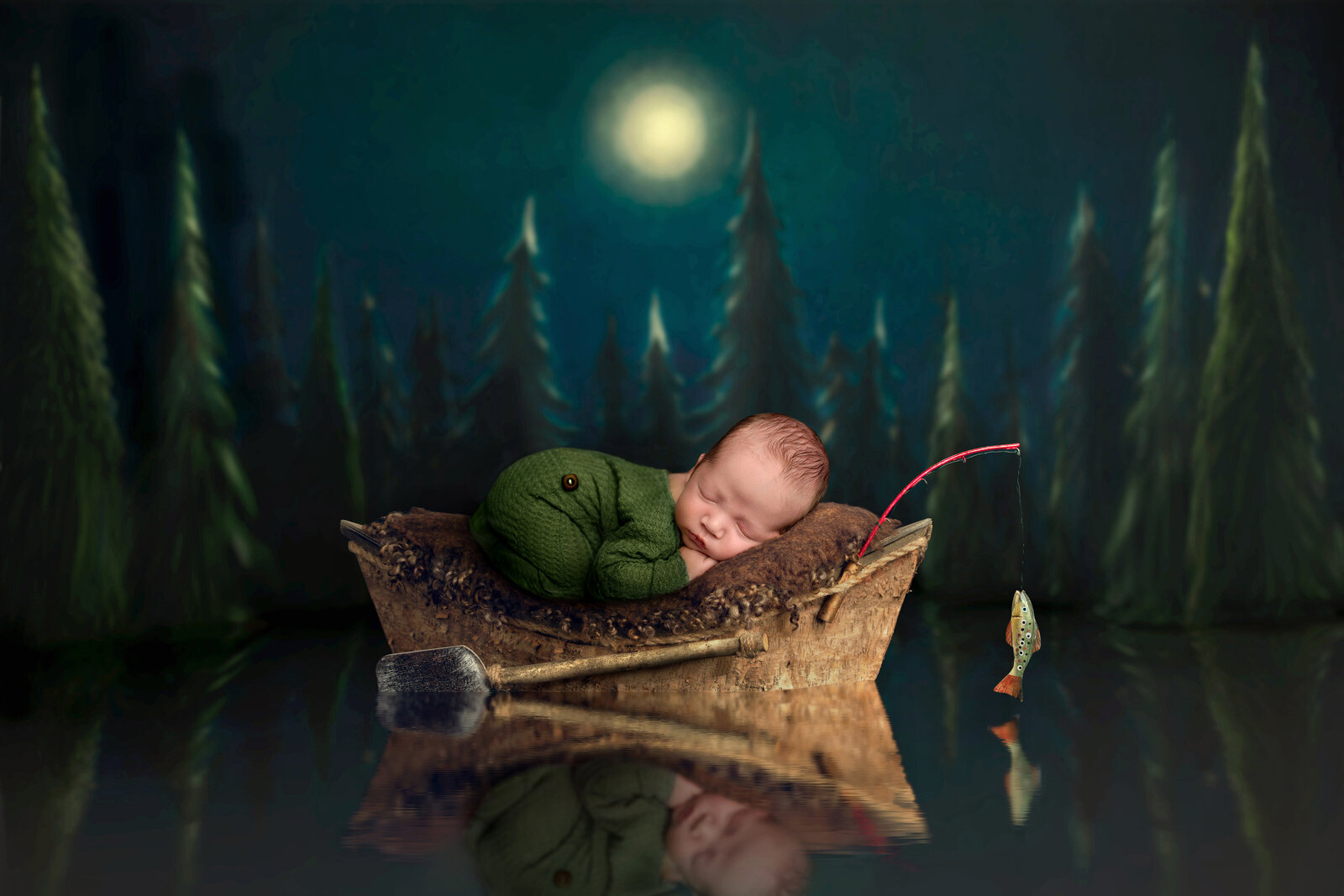 baby fishing in a photoshoot at night with a forest scenery